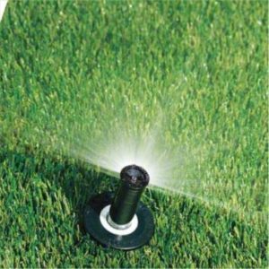 A lawn sprinkler spraying water on the grass.